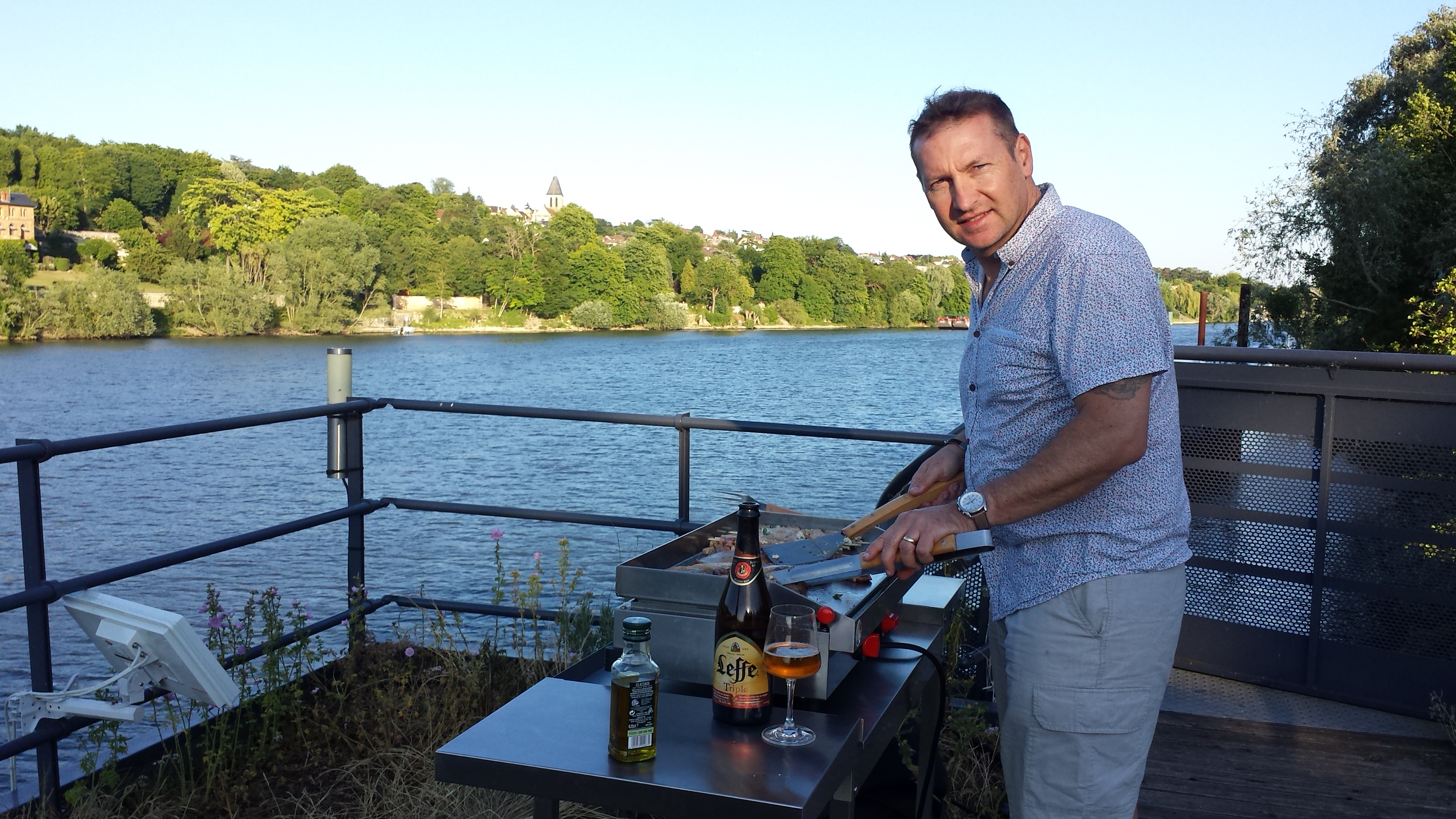 Tim cooks dinner on the top deck